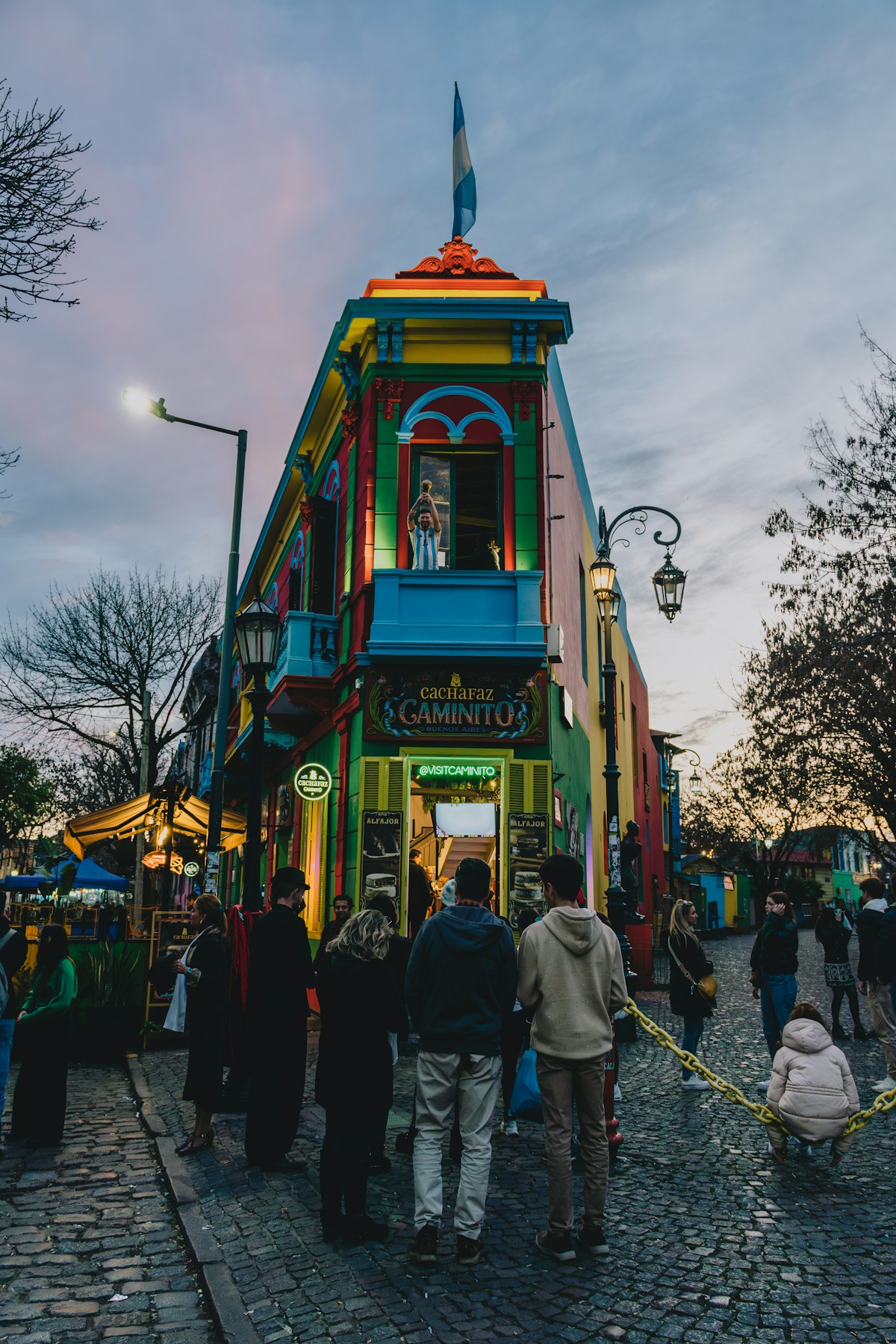 Tourists outside the colourful Caminito street building in La Boca, Buenos Aires
