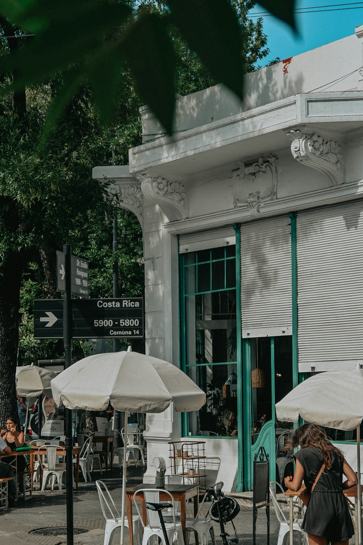 Outdoor cafe tables on a leafy Buenos Aires street, Palermo, Argentina