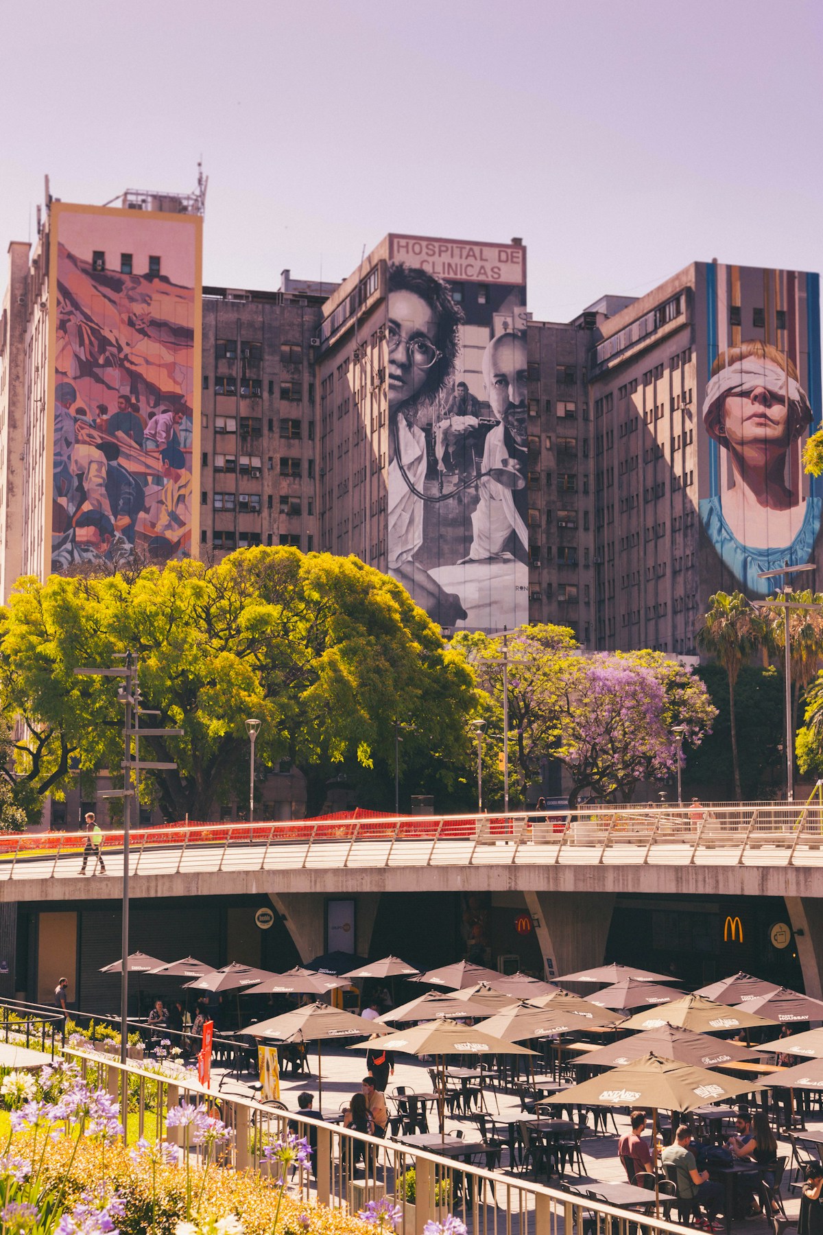 Large murals covering the facade of a building in central Buenos Aires — street art in the city