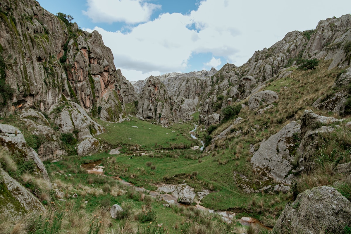 Rocky mountain valley with green grassland, Córdoba Province sierras, Argentina