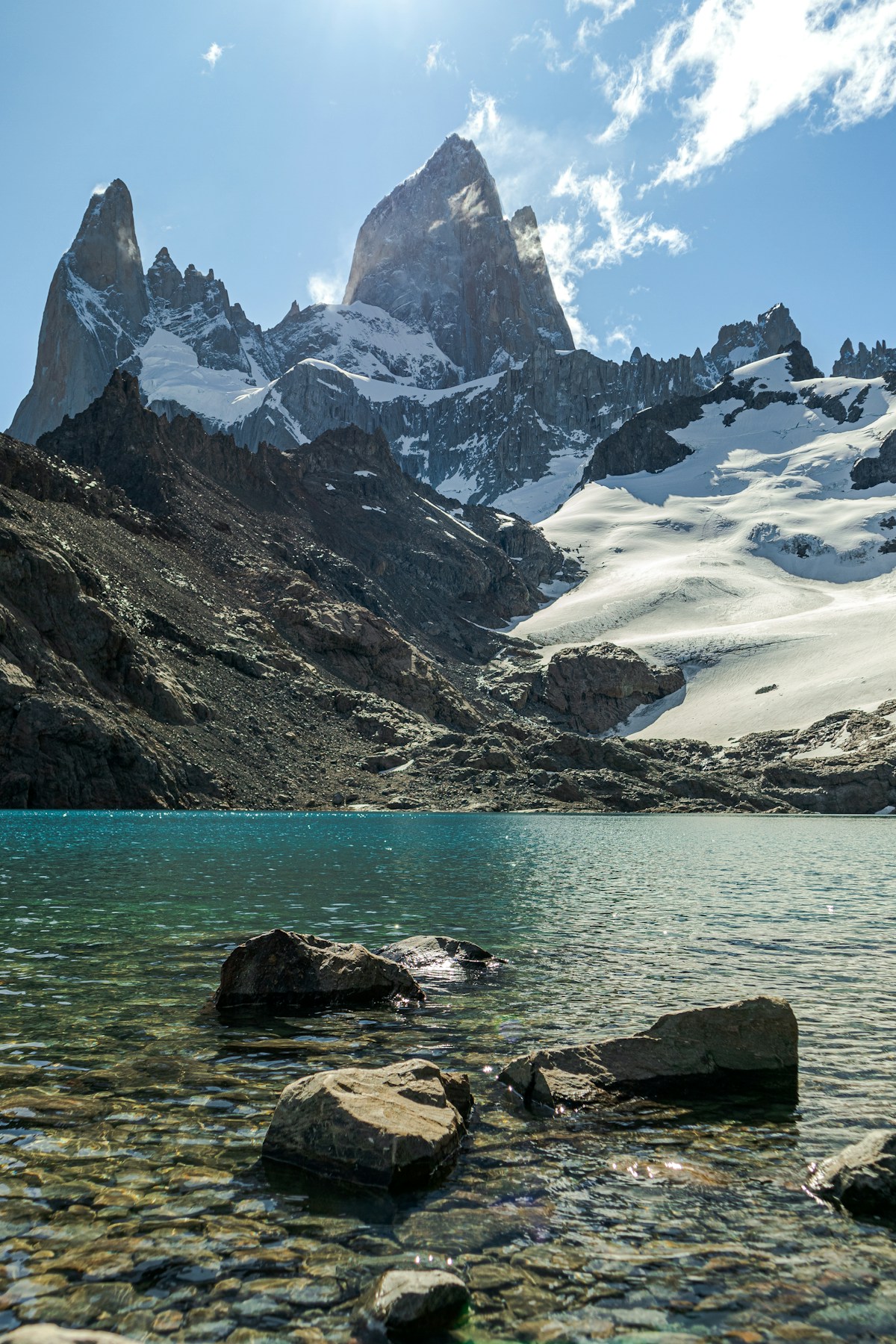 Fitz Roy massif and glacial lake with turquoise water and rocky foreground, El Chaltén, Santa Cruz Province, Argentina