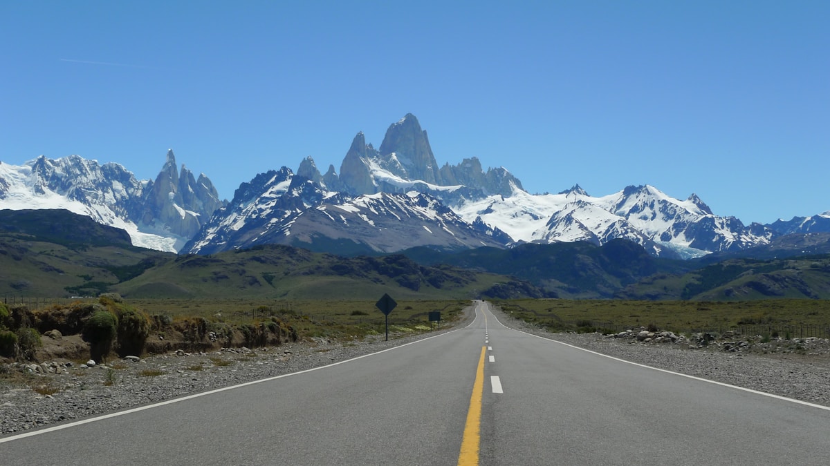Road leading to the Fitz Roy massif under clear blue sky, El Chaltén, Patagonia, Argentina