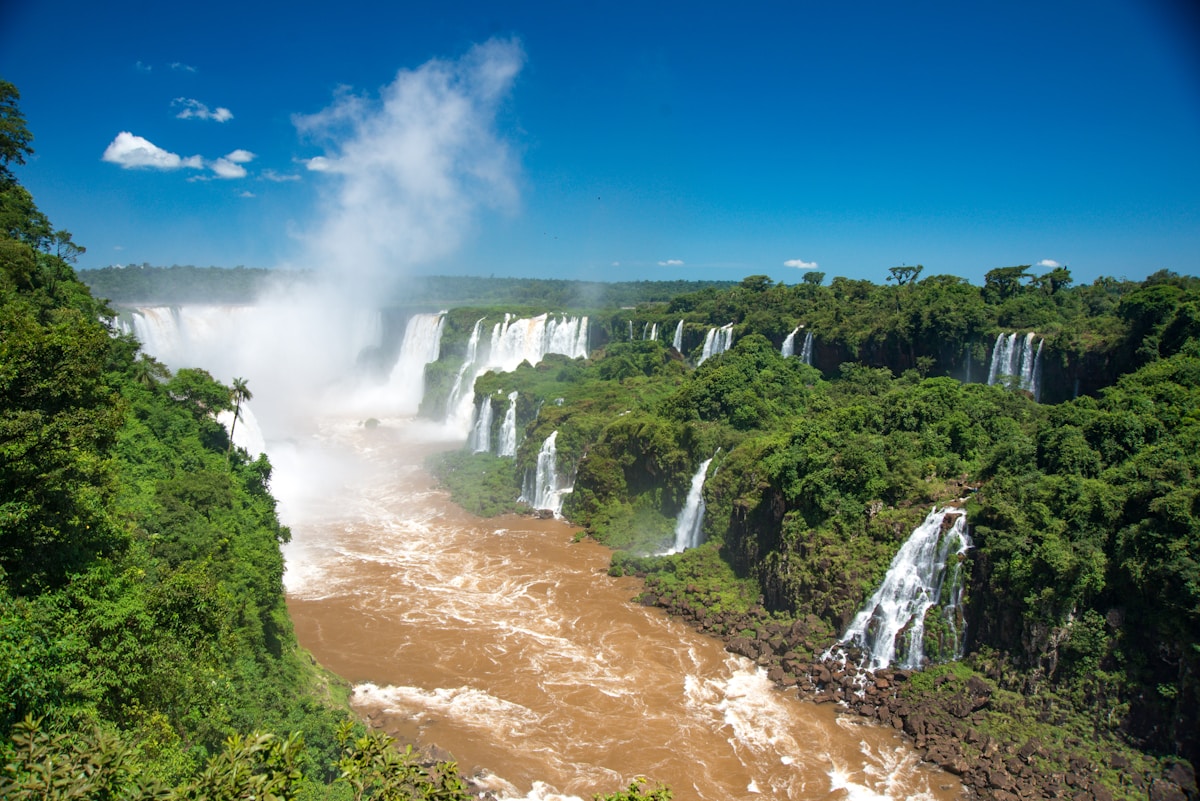 Iguazú Falls panorama with multiple cascades and mist rising above the Iguazú River, Argentina