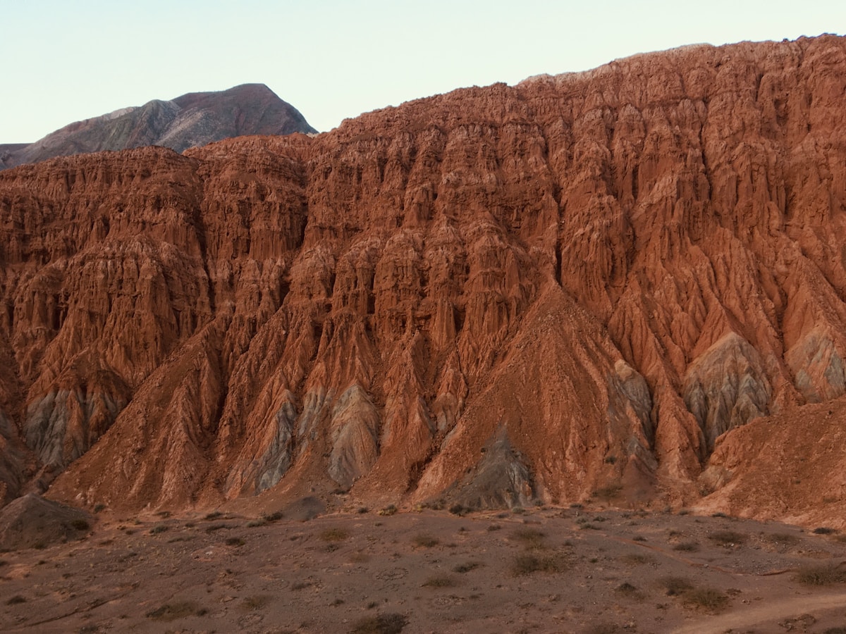Dramatic red and ochre rock formations of the Quebrada de Humahuaca near Purmamarca, Jujuy Province, Argentina