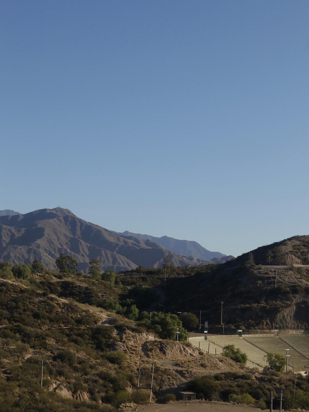 Mountain range with arid hills and clear blue sky, Mendoza, Argentina