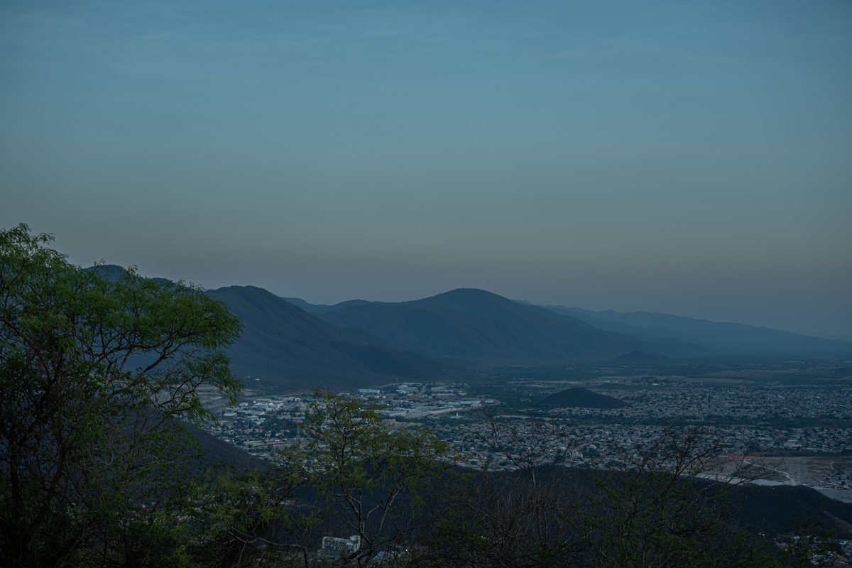Salta city viewed from Cerro San Bernardo at dusk, with Andes foothills in the background, Argentina