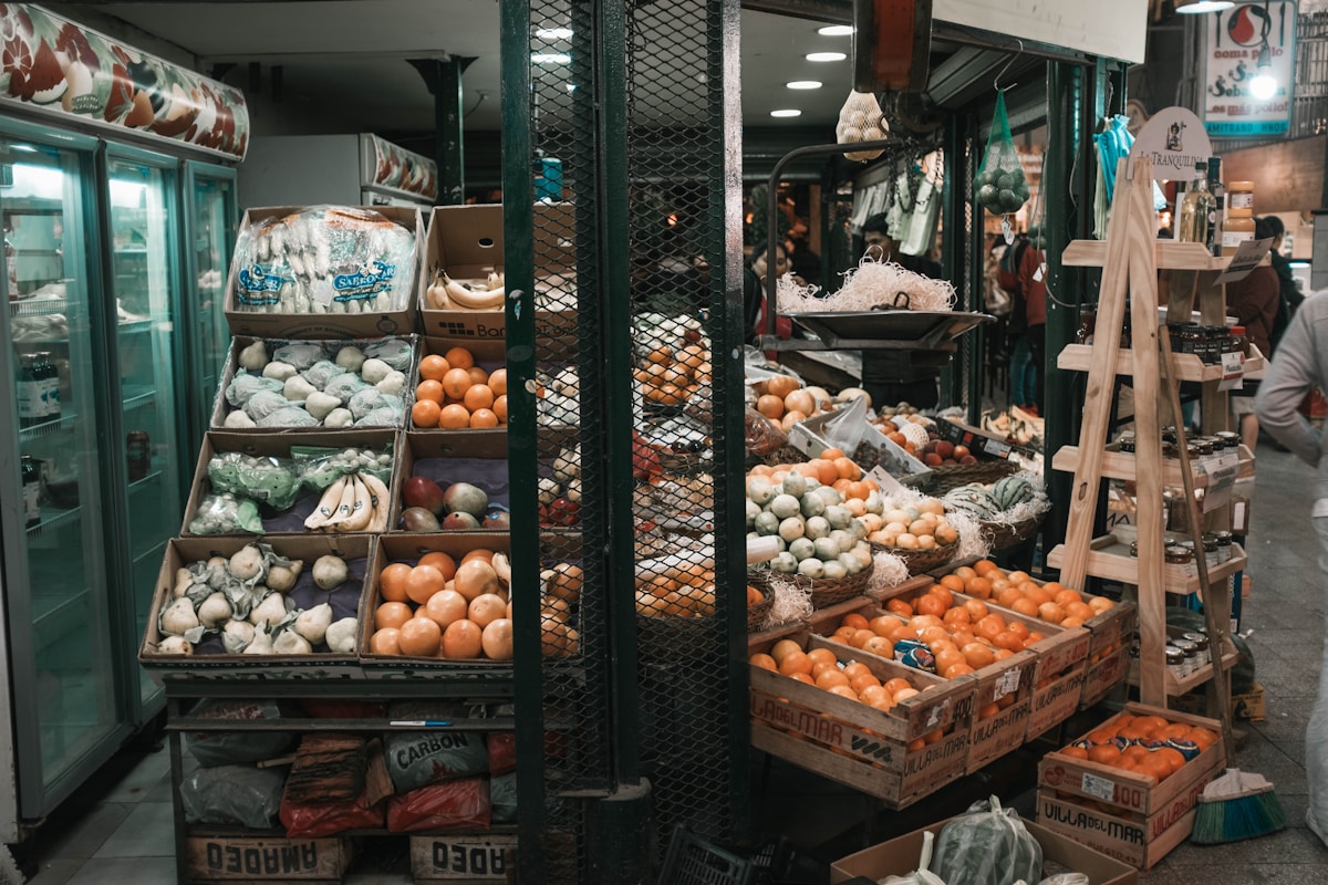 Indoor market stall with fresh fruits and vegetables, Argentina
