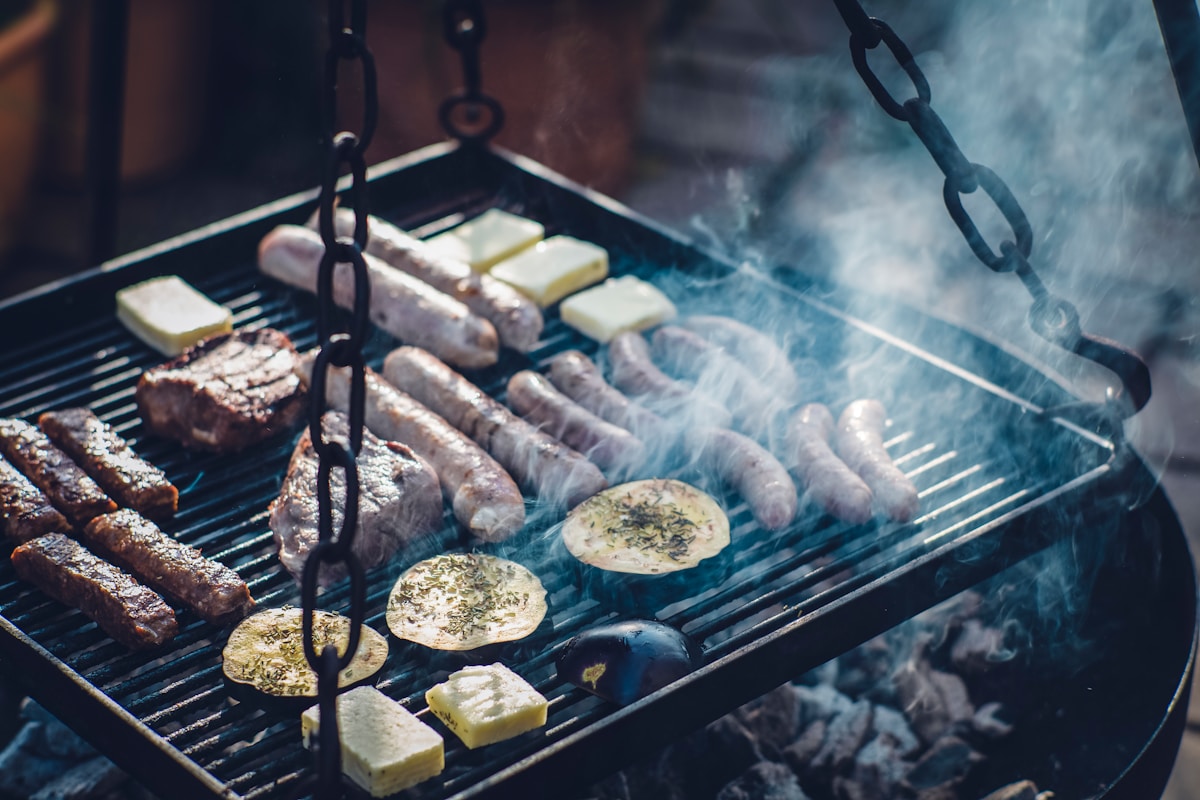 Argentine asado with beef cuts and chorizo on a wood-fired grill