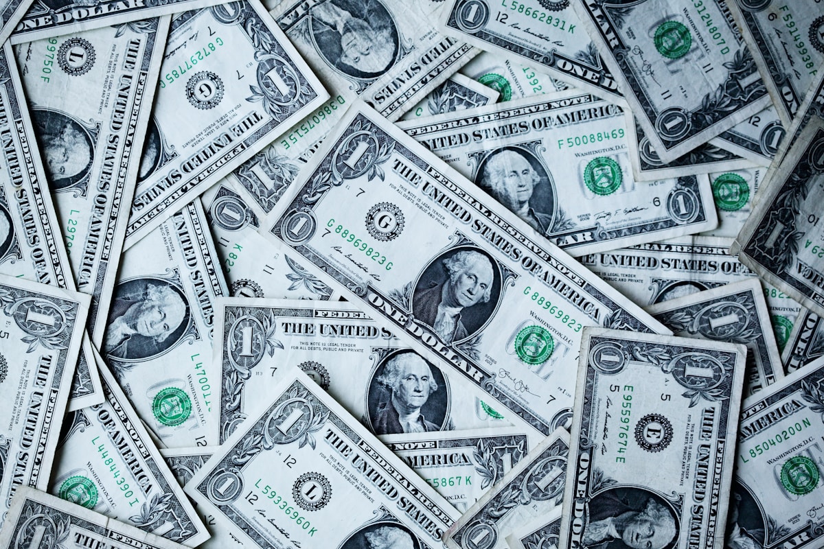 US dollar banknotes spread on a surface — currency exchange in Argentina