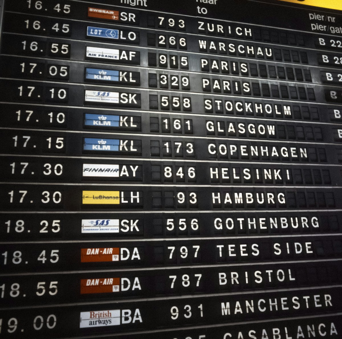 Airport departure board showing delayed flights
