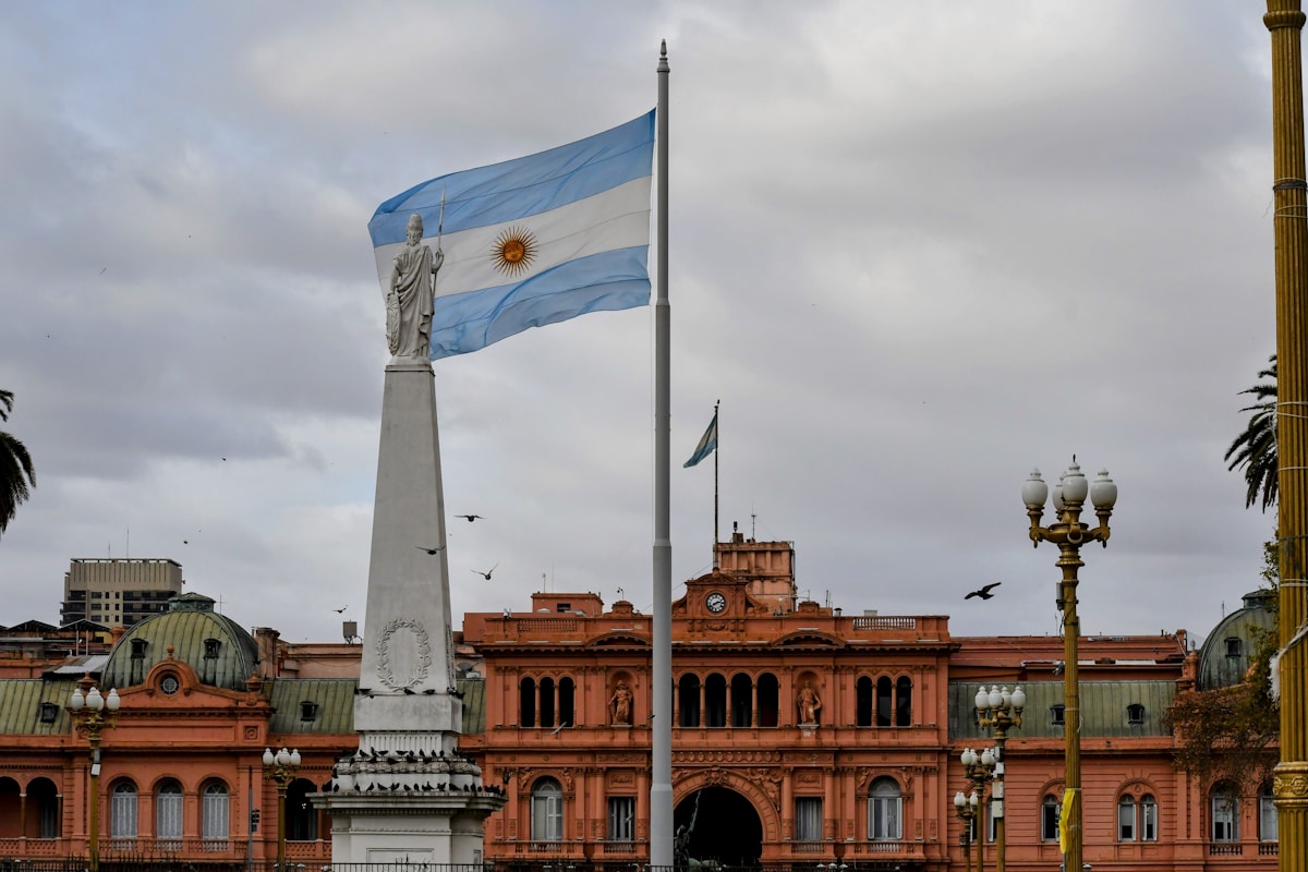Argentine flag flying in front of the Casa Rosada presidential palace in Buenos Aires