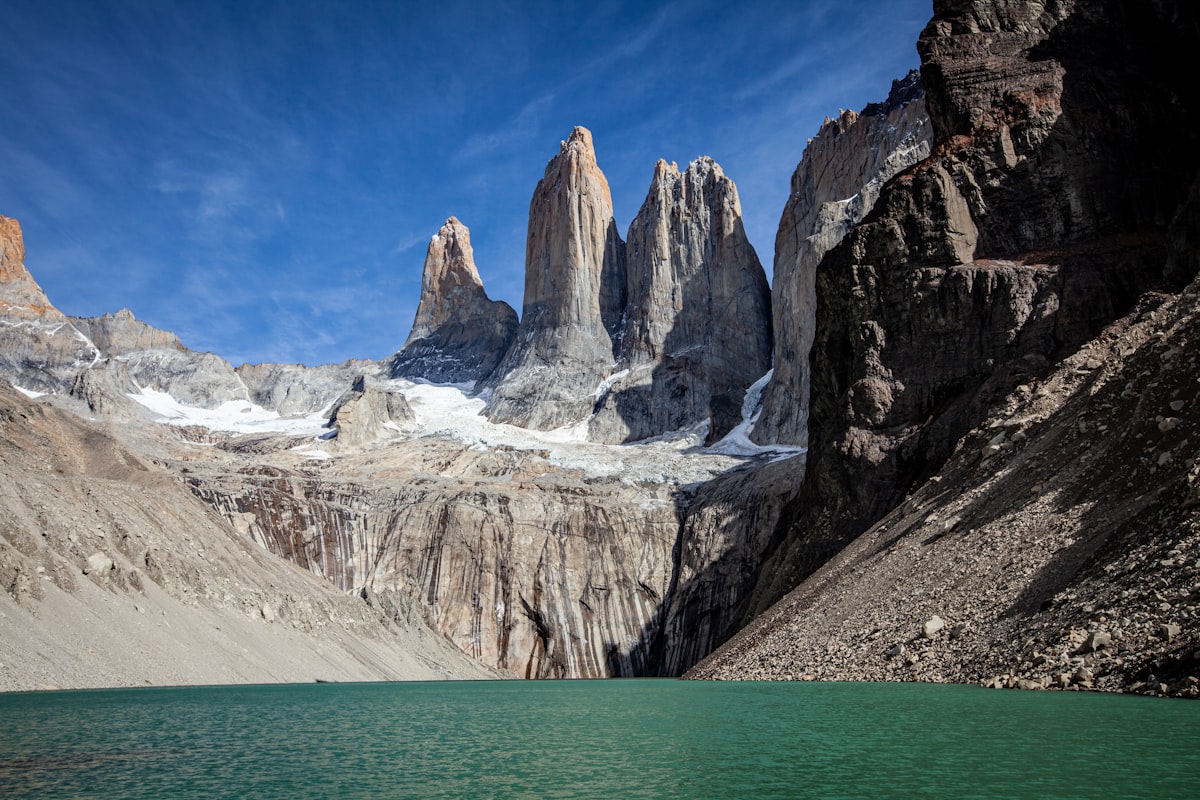 The iconic granite towers of Torres del Paine above a turquoise glacial lake in Chilean Patagonia
