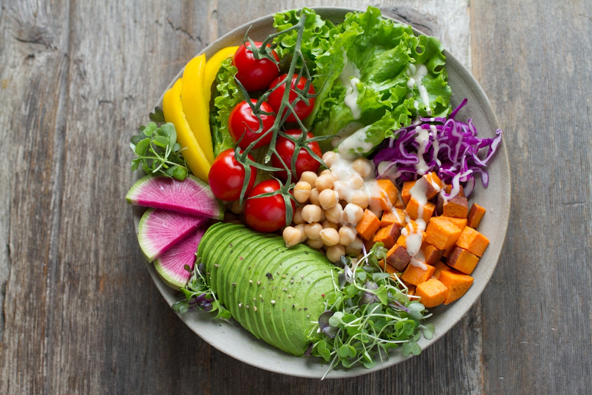 Colourful vegan bowl with avocado, chickpeas and fresh vegetables