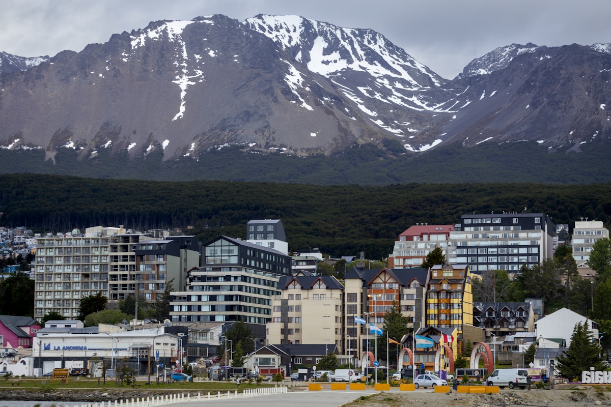 City buildings with snow-capped mountains behind, Ushuaia, Tierra del Fuego, Argentina